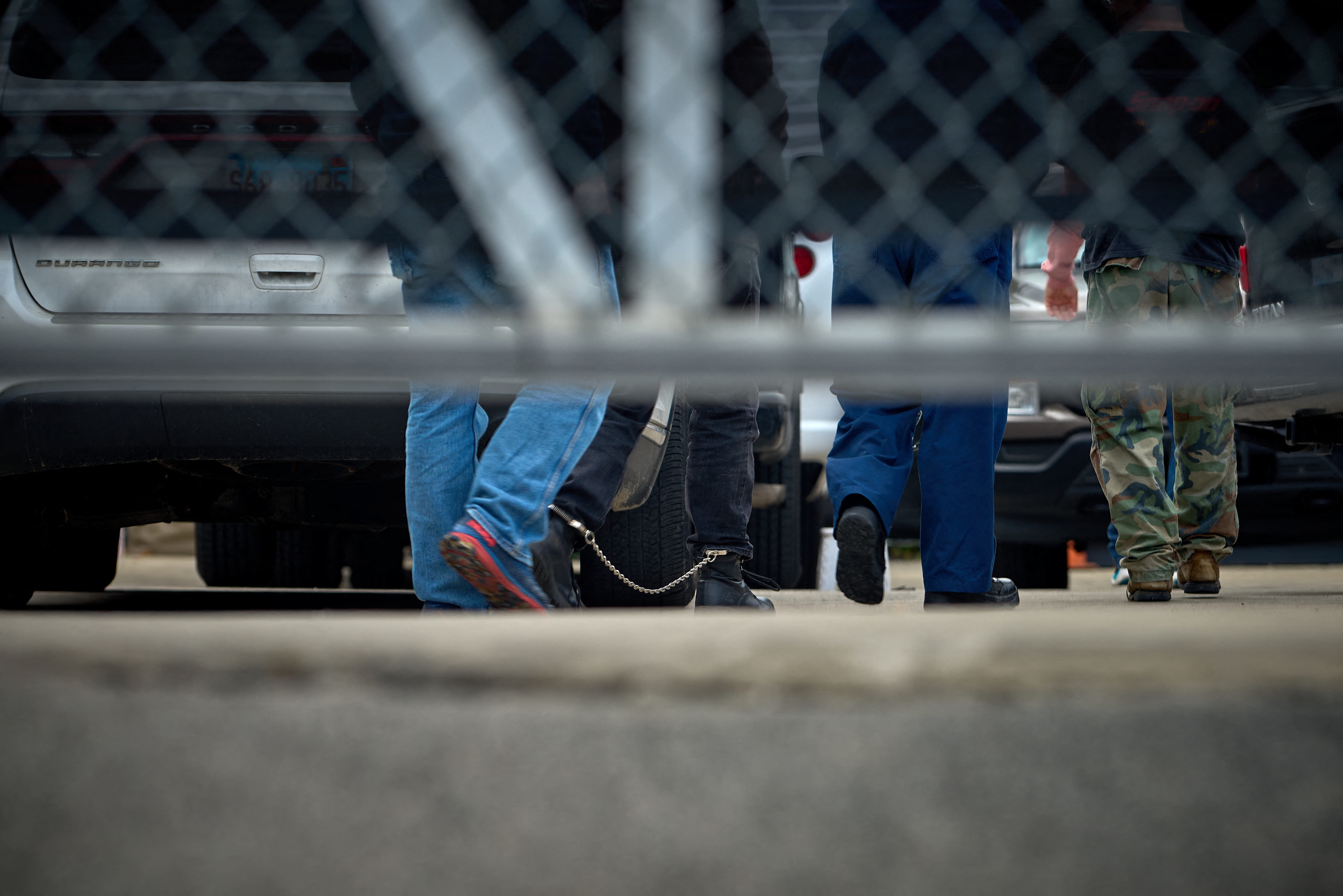 People detained by federal agents walk into a suburban Chicago ICE detention center in Broadview, Ill., on Sept. 19.